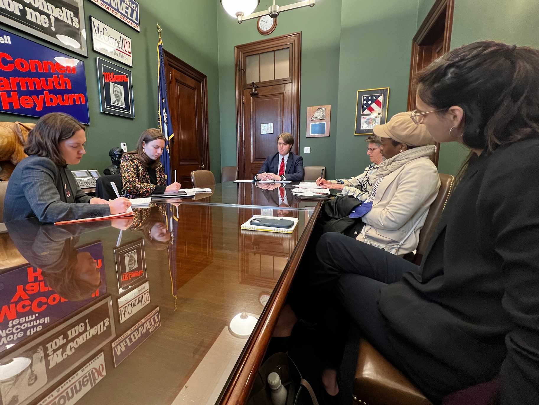 Photo of advocates at a meeting with a congressional staffer.